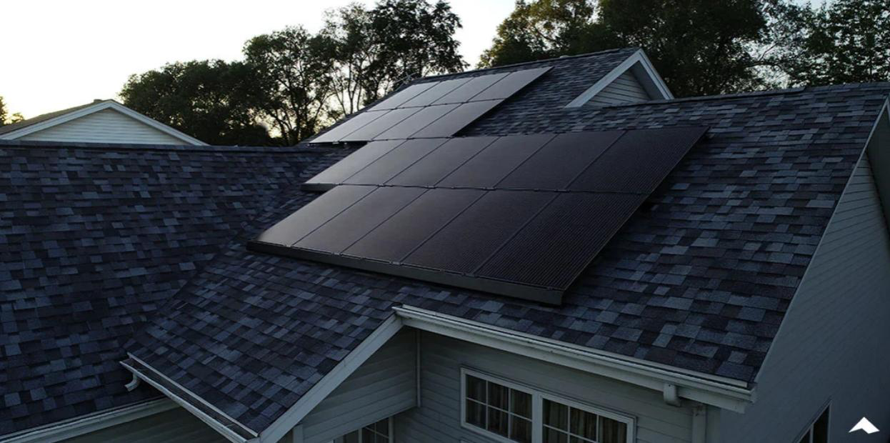 Black solar panels installed on a residential roof in Western New York